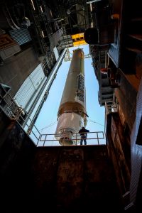 The booster of a United Launch Alliance Atlas V rocket that will launch the Solar Orbiter spacecraft is lifted into the vertical position at the Vertical Integration Facility near Space Launch Complex 41 at Cape Canaveral Air Force Station in Florida on Jan. 6, 2020.