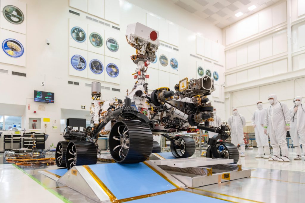 Engineers observe the first driving test for NASA's Mars 2020 Perseverance rover in a clean room at NASA's Jet Propulsion Laboratory in Pasadena, California, on Dec. 17, 2019.