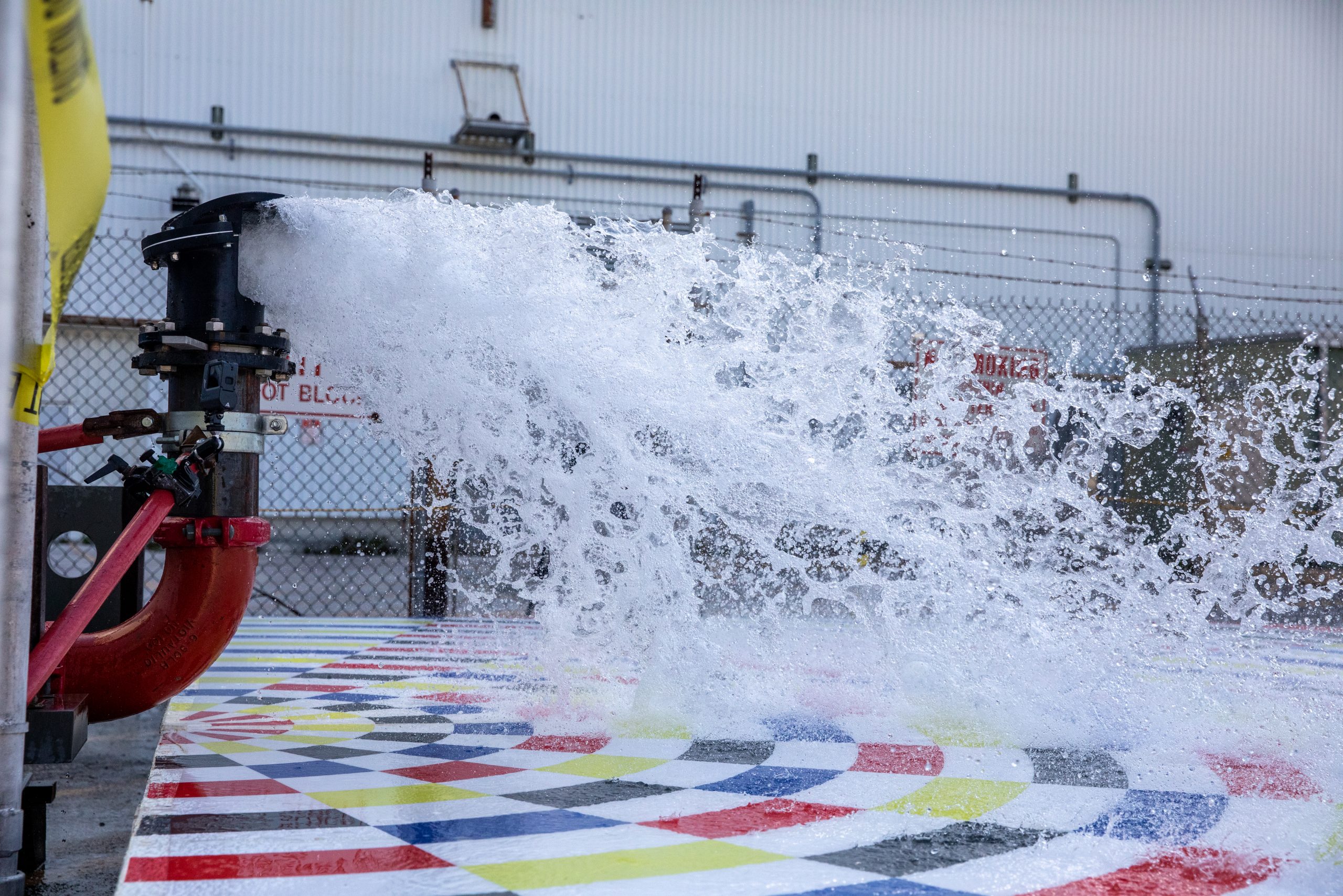 Water spraying out of a nozzle for rainbird testing for the Artemis II mission.