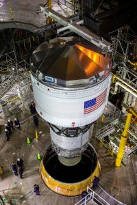 Teams with NASA’s Exploration Ground Systems and contractor Jacobs integrate the interim cryogenic propulsion stage (ICPS) for NASA’s Space Launch System (SLS) rocket with the launch vehicle stage adapter (LVSA) atop the massive SLS core stage in the agency’s Vehicle Assembly Building (VAB) at NASA’s Kennedy Space Center in Florida on July 5, 2021. 