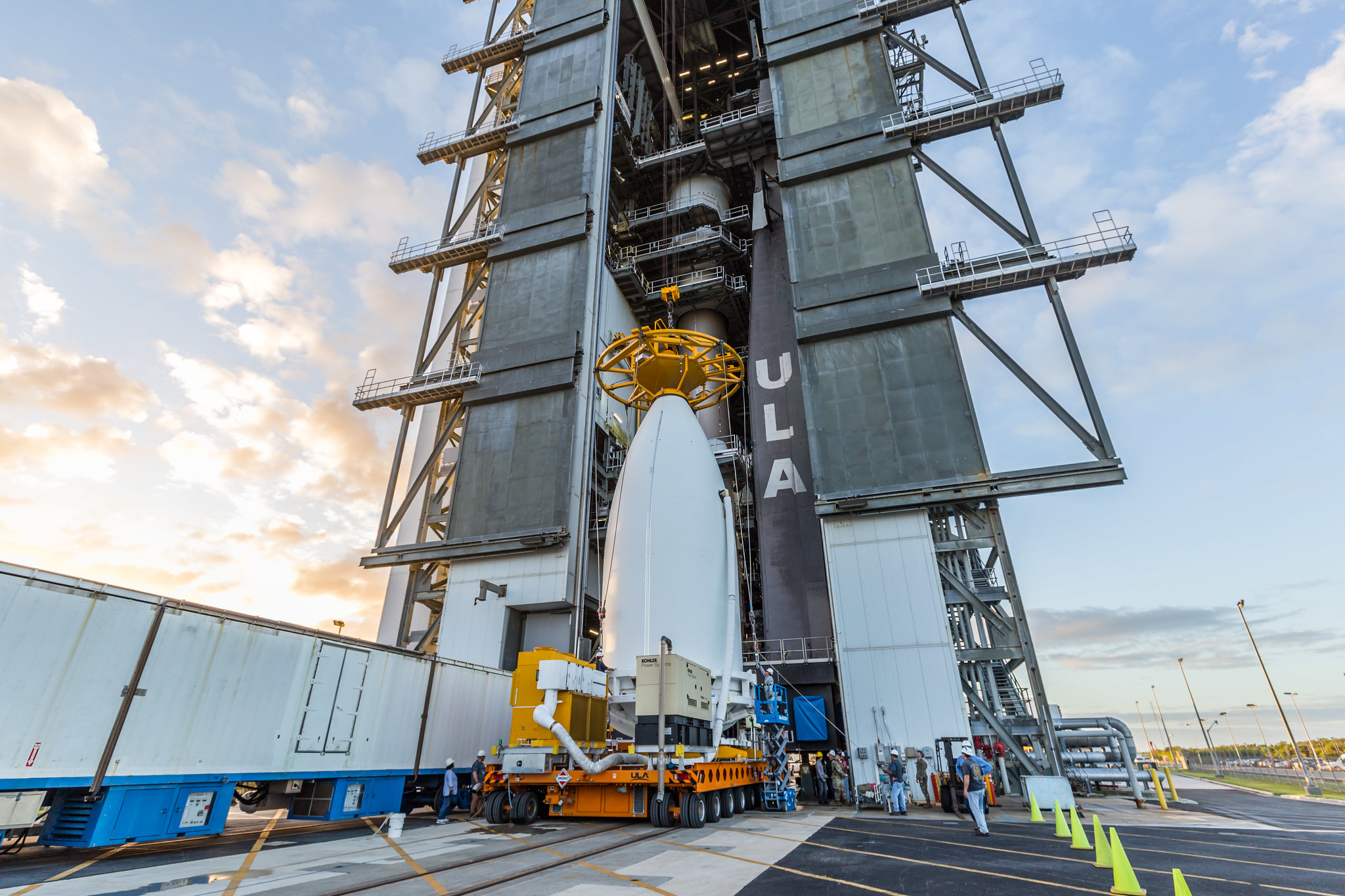 Teams prepare to lift the STP-3 spacecraft and attach it to the top of ULA's Atlas V rocket.