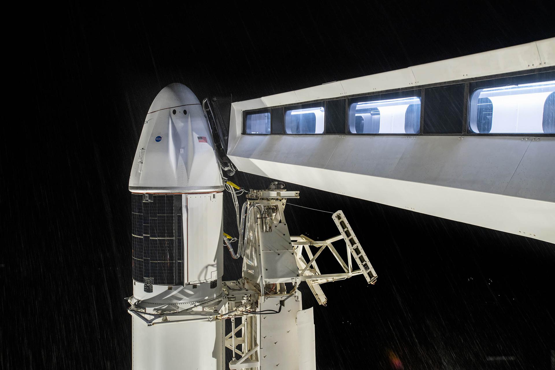 A close-up view of SpaceX's cargo Dragon spacecraft atop the Falcon 9 rocket at Launch Complex 39A at Kennedy Space Center.