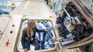 NASA Deputy Administrator Dr. Dava Newman explores a prototype Orion spacecraft. Photo credit: NASA