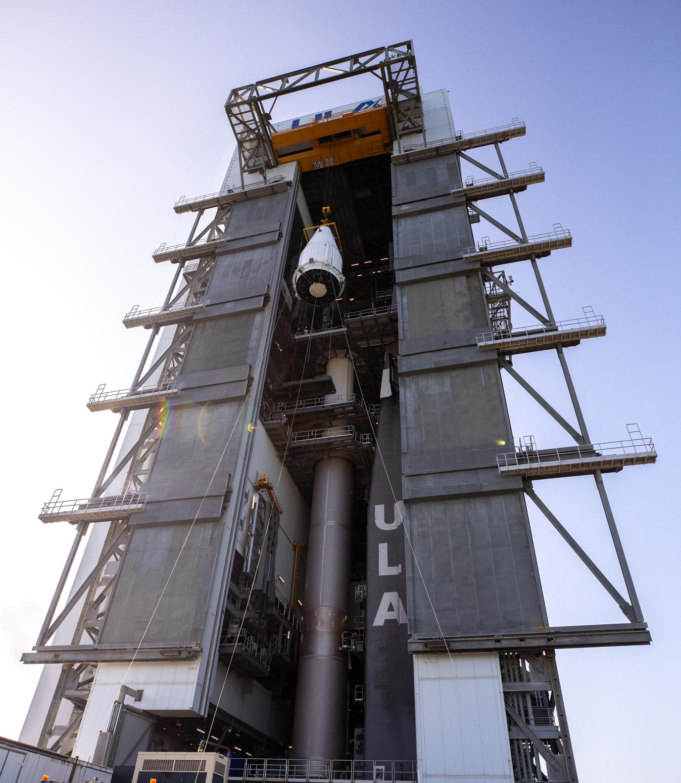 The payload fairing containing NASA’s Lucy spacecraft is hoisted up at the Vertical Integration Facility at Space Launch Complex 41 at Cape Canaveral Space Force Station in Florida on Oct. 7, 2021. 