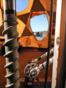 The Icebreaker-1 rotary-percussive Mars-prototype drill with its sample-transfer arm, in July 2012 tests at Haughton Crater's Drill Hill.  