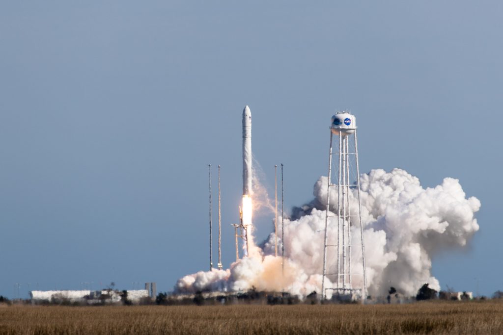 white rocket lifting off