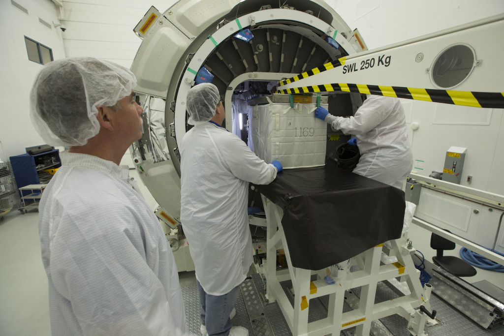 Orbital ATK specialists at NASA's Wallops Flight Facility in Virginia load the Cygnus cargo module with supplies for the International Space Station. Credit: NASA Wallops/Patrick Black