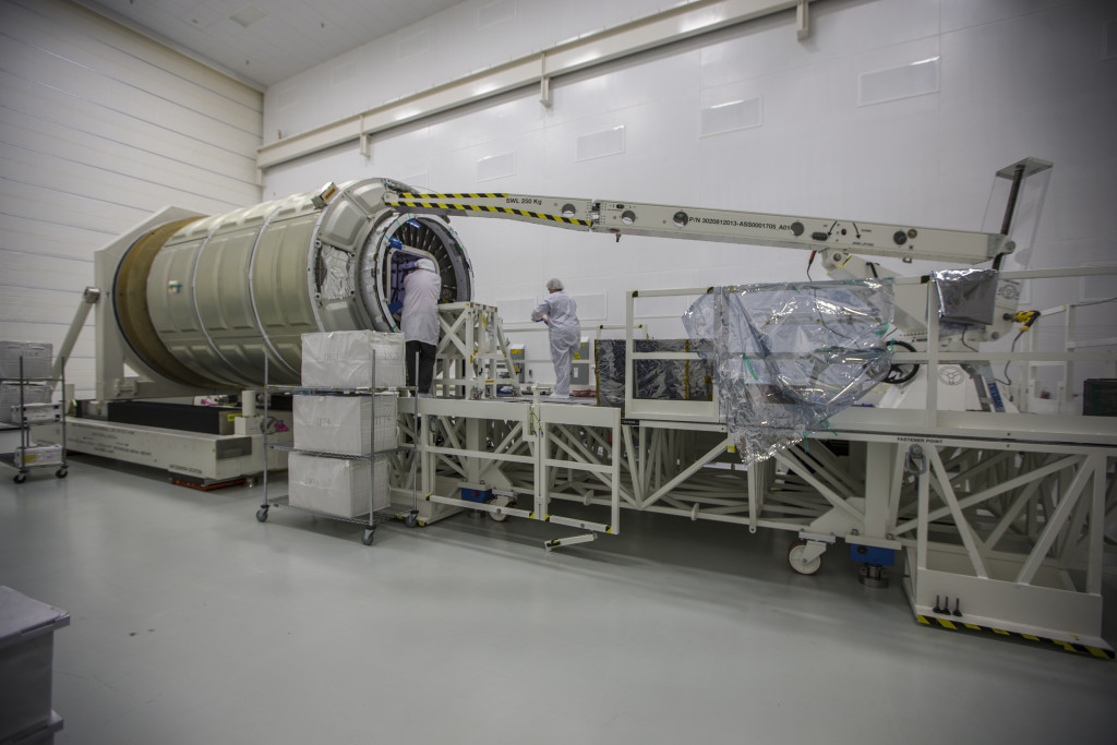 Orbital ATK technicians load Cygnus