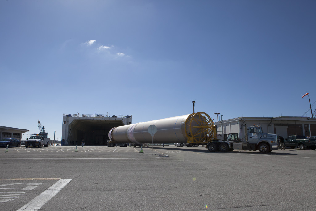 ULA Atlas V first stage arriving and offloading at wharf and being transported to the ASOC for Orbital ATK CRS-6