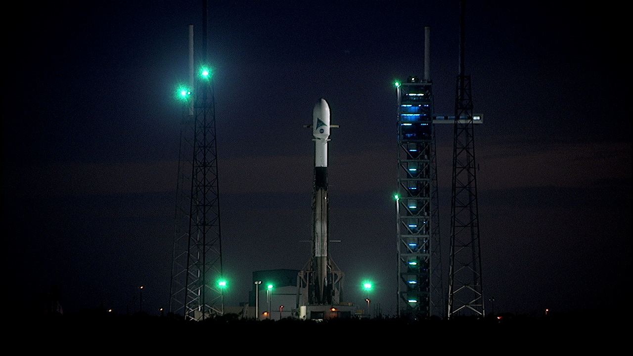 A SpaceX Falcon 9 rocket topped with NASA's PACE (Plankton, Aerosol, Cloud, ocean Ecosystem) spacecraft inside a protective payload fairing is raised vertical at Space Launch Complex 40 at Cape Canaveral Space Force Station in Florida. 