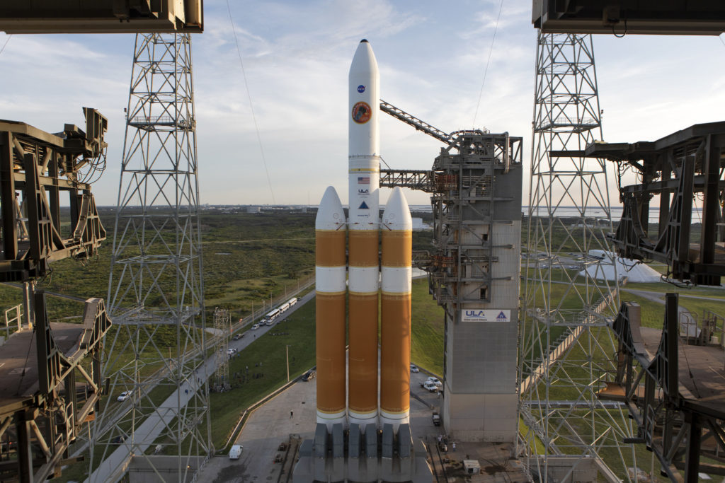 : The United Launch Alliance Delta IV Heavy rocket that will launch NASA's Parker Solar Probe on a mission to study to Sun is seen as the Mobile Service Tower gantry at Space Launch Complex 37 rolls back on Friday, Aug. 10, 2018, at Cape Canaveral Air Force Station in Florida.