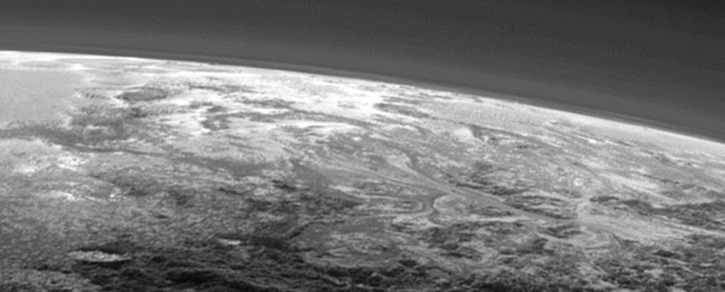 Flow patterns from the lower right of the image, extending to the center of Pluto’s informally-named Sputnik Planum.