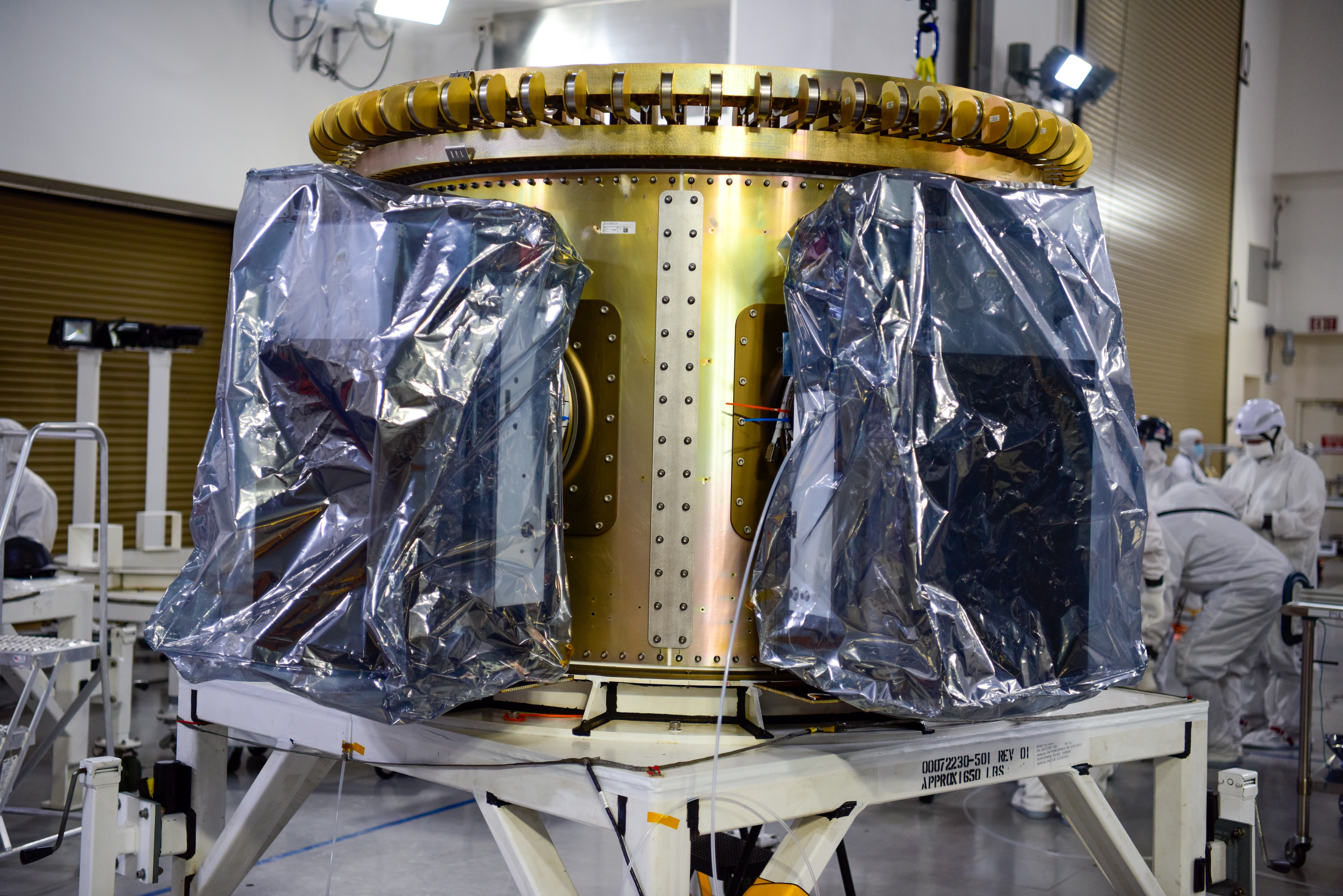 Technicians integrate NASA’s four PUNCH (Polarimeter to Unify the Corona and Heliosphere) satellites to the evolved expendable launch vehicle secondary payload adapter array ring inside the Astrotech Space Operations Facility at Vandenberg Space Force Base in California on Friday, Feb. 14, 2025. The PUNCH mission is launching as a rideshare with NASA’s SPHEREx (Spectro-Photometer for the History of the Universe, Epoch of Reionization and Ices Explorer) observatory. 