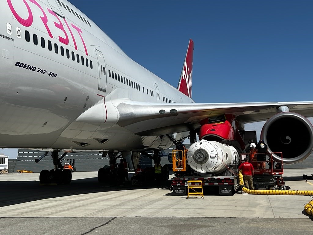 Virgin Orbit's LauncherOne rocket is attached to the underside of the company's Cosmic Girl aircraft.