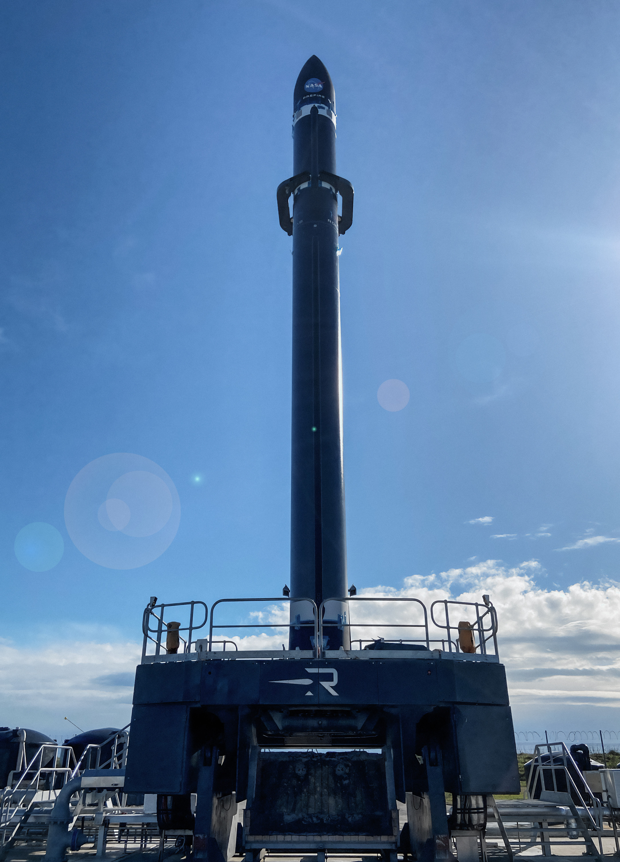 Rocket Lab’s Electron rocket called “Ready, Aim, PREFIRE” is vertical on the pad in Mahia, New Zealand ahead of launching the first of two PREFIRE CubeSats on May 25, 2024. 