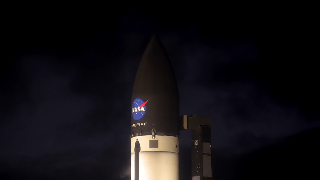 Night shot of Rocket Lab payload fairing with NASA logo and PREFIRE mission name painted on it.