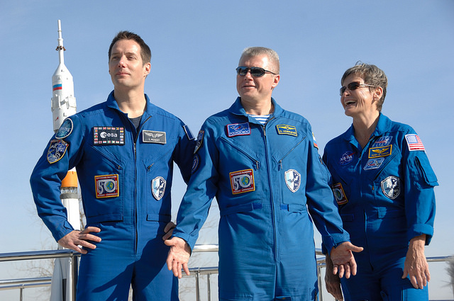 At the Cosmonaut Hotel crew quarters in Baikonur, Kazakhstan, Expedition 50-51 crew members Thomas Pesquet of the European Space Agency (left), Oleg Novitskiy of the Russian Federal Space Agency (Roscosmos, center) and Peggy Whitson of NASA (right) pose for pictures Nov. 10 during preflight activities. They will launch Nov. 18, Baikonur time, on the Soyuz MS-03 spacecraft for a six-month mission on the International Space Station. Credit: NASA/Alexander Vysotsky