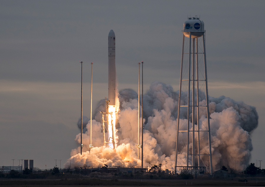 The Antares rocket lifts off with the Cygnus cargo craft aboard