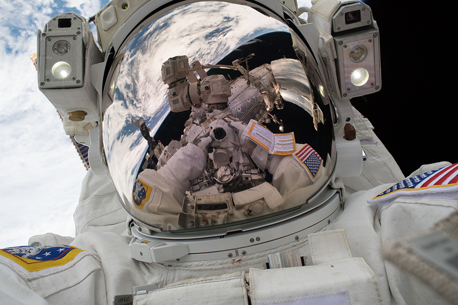 two astronauts floating in space