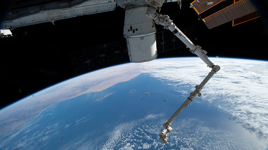 The SpaceX Dragon cargo craft and the Canadarm2 robotic arm