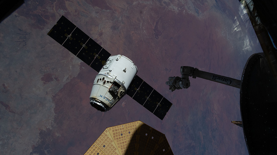 The SpaceX Dragon cargo craft begins its departure