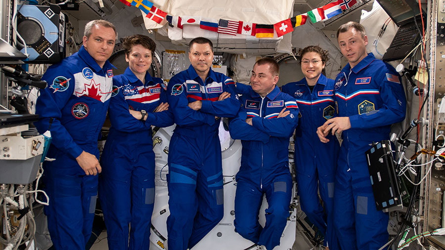 The six-member Expedition 59 crew gathers for a portrait