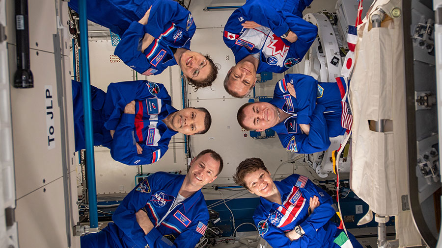 The six-member Expedition 59 crew gathers for a portrait