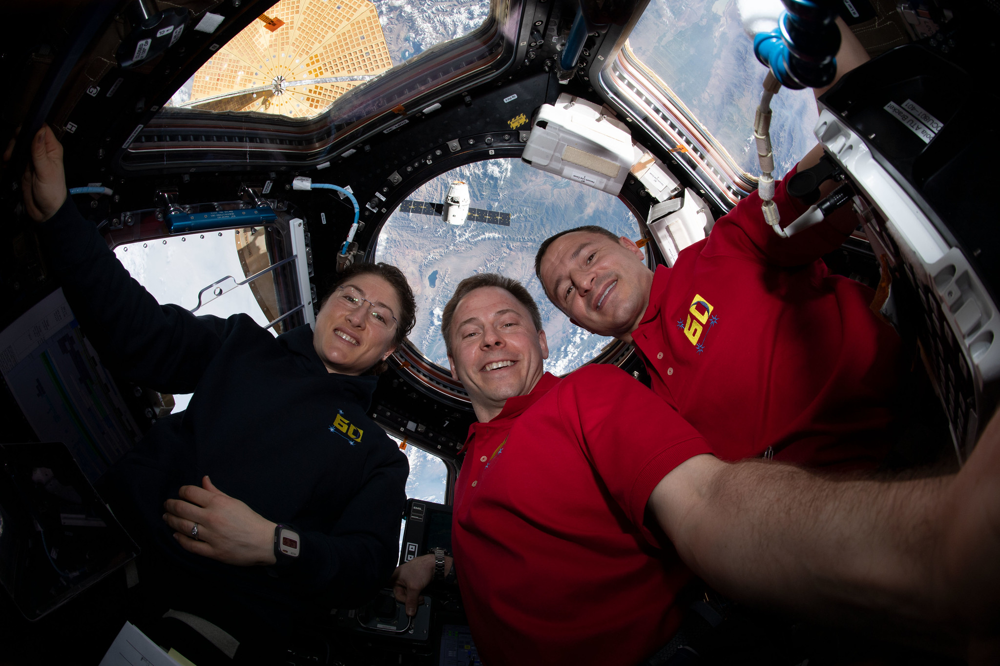 NASA astronauts (from left) Christina Koch, Nick Hague and Andrew Morgan gather for a portrait inside the International Space Station's 