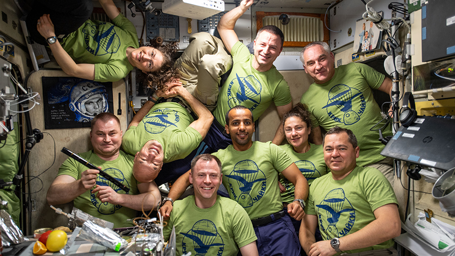 The nine International Space Station residents pose for a portrait