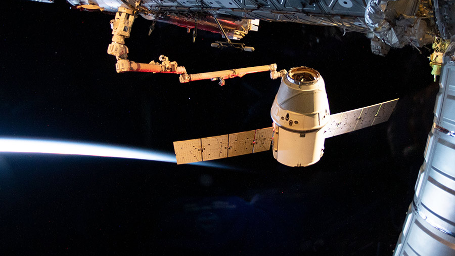 The SpaceX Dragon cargo craft is pictured moments before its release