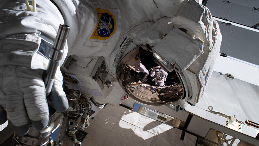 Reflection in NASA astronaut Jessica Meir's spacesuit helmet 