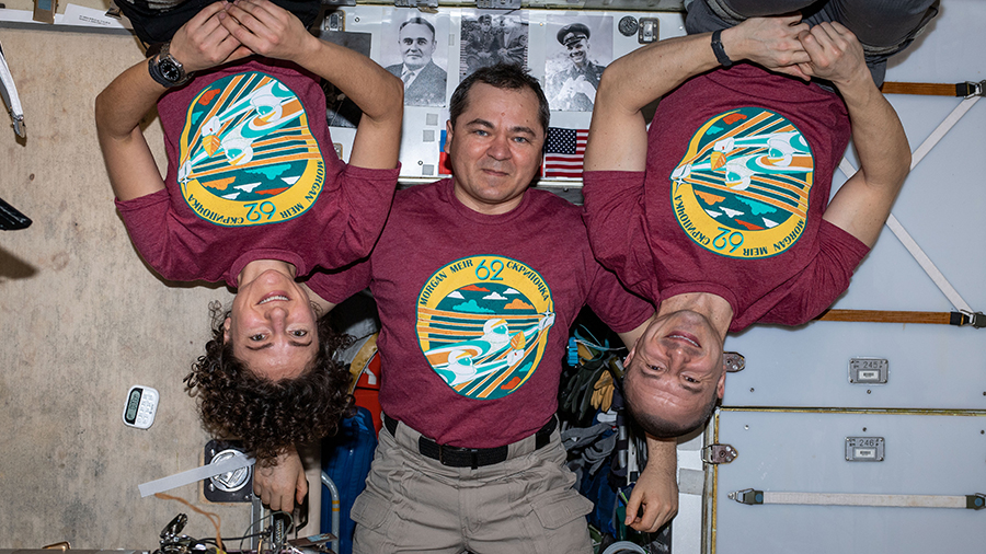 The three-member Expedition 62 crew