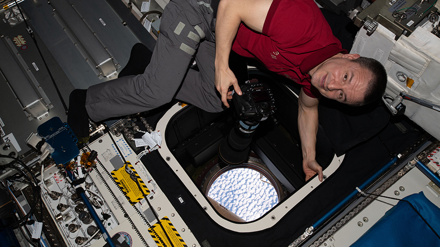 NASA astronaut and Andrew Morgan takes photographs of the Earth