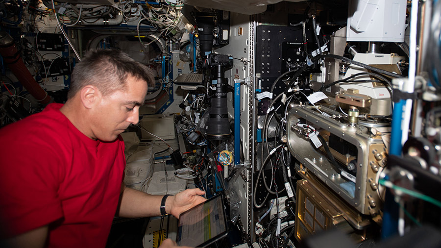 Expedition 63 Commander Chris Cassidy works on the Fluids Integrated Rack