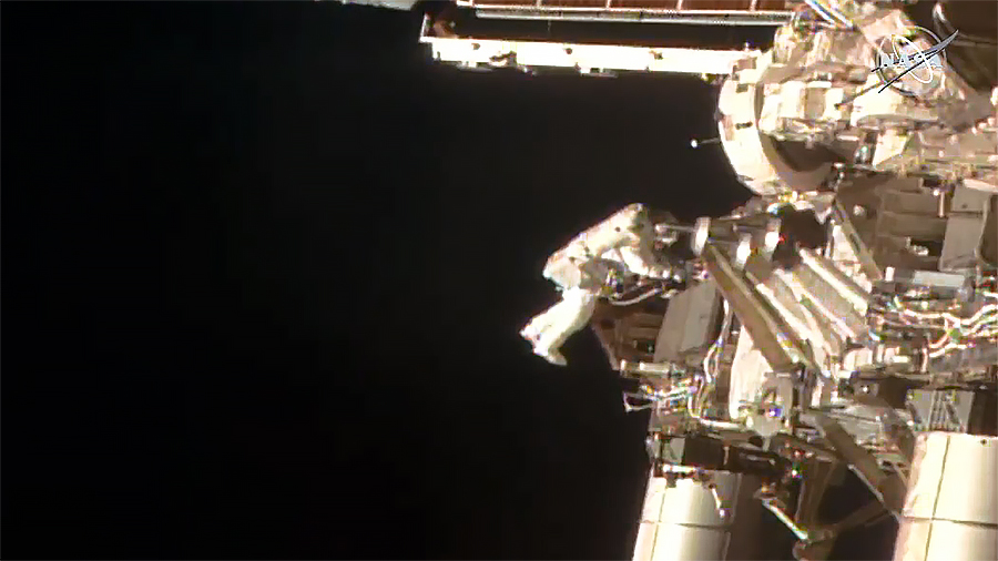 NASA astronaut Bob Behnken is pictured tethered to the space station during a spacewalk to swap batteries on the orbiting lab's truss structure.