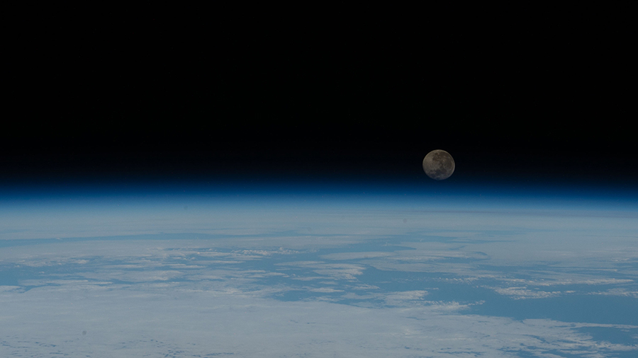 A waning gibbous Moon is pictured just above the Earth's horizon on June 7, 2020.