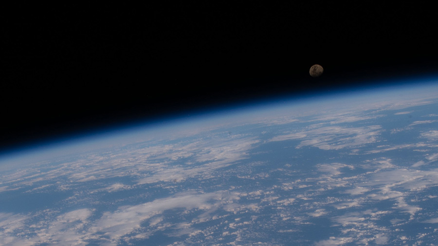 A waxing gibbous moon is pictured above the Earth's horizon as the station orbited above the Atlantic Ocean off the coast of Brazil.