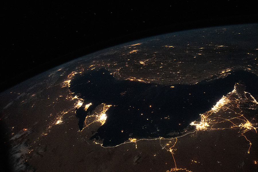 The well-lit Middle Eastern cities along the Persian Gulf coast of the Arabian Peninsula to the north of Iran were photographed from the International Space Station during an orbital night pass.