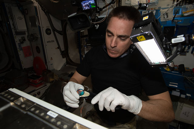 A view of NASA astronaut Chris Cassidy during hardware setup aboard the International Space Station. Credits: NASA