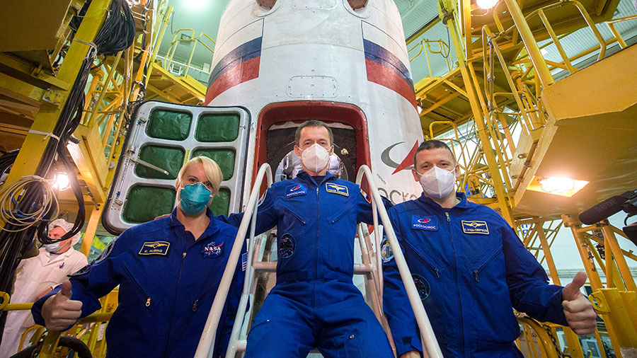 The Expedition 64 crew poses in front of the Soyuz MS-17 spacecraft that will launch the trio to the space station on Oct. 14. Credit: NASA/GCTC/Andrey Shelepin