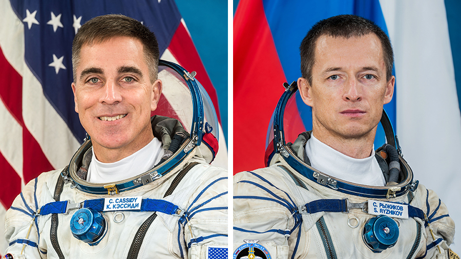 NASA astronaut Chris Cassidy (left) will hand over command of the station to Roscosmos cosmonaut Sergey Ryzhikov (right) today.