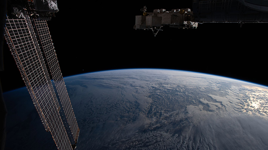 The Earth's limb, or horizon, is pictured as the space station orbited above the north Pacific near Alaska's Aleutian Islands.