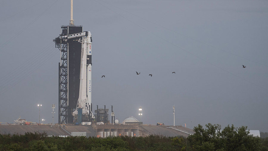 The SpaceX Falcon 9 rocket with the company's Crew Dragon spacecraft atop is seen at its launch pad at NASA’s Kennedy Space Center in Florida.