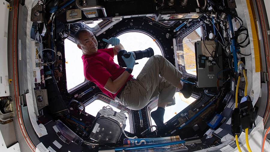 Expedition 64 Flight Engineer Soichi Noguchi gives a "thumbs up" inside the seven-windowed cupola, the International Space Station's "window to the world."