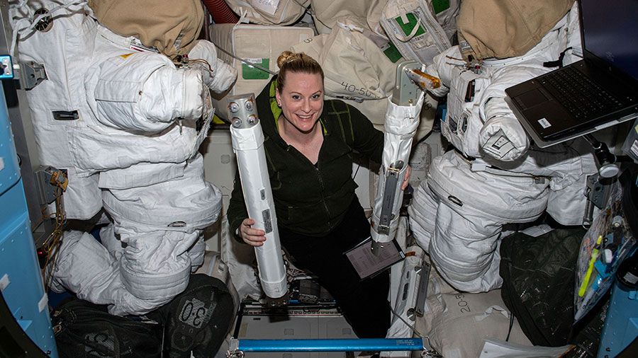 Expedition 64 Flight Engineer Kate Rubins is pictured with spacewalk hardware inside the Quest airlock where spacewalks in U.S. spacesuits are staged.