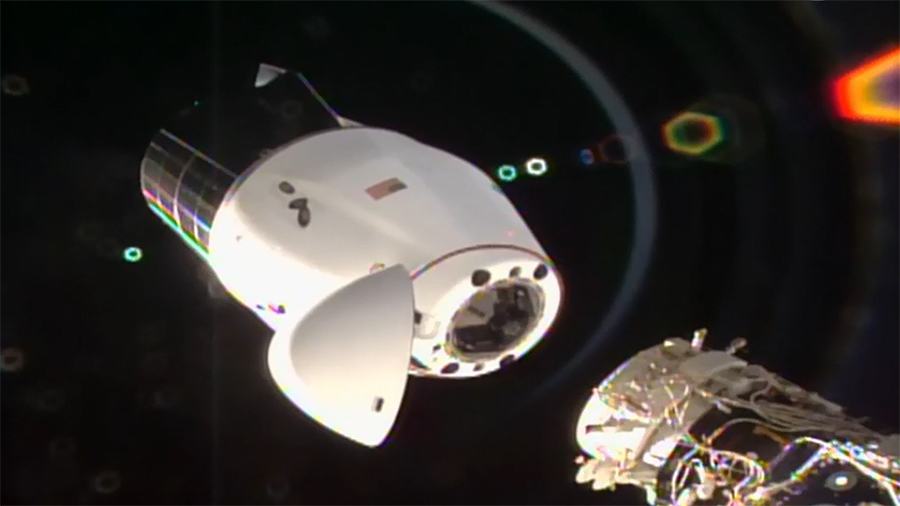 The SpaceX Cargo Dragon vehicle begins its separation from the station after undocking from the Harmony module's international docking adapter. Credit: NASA TV