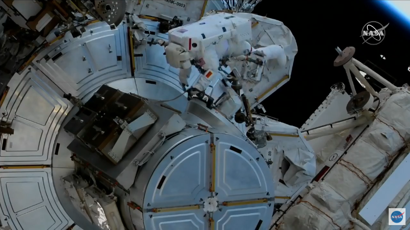 On March 13, 2021, NASA spacewalker and Expedition 64 Flight Engineer Victor Glover works to route cables and complete tasks that were deferred from previous spacewalks during this year’s fifth spacewalk in support of space station maintenance. Credits: NASA