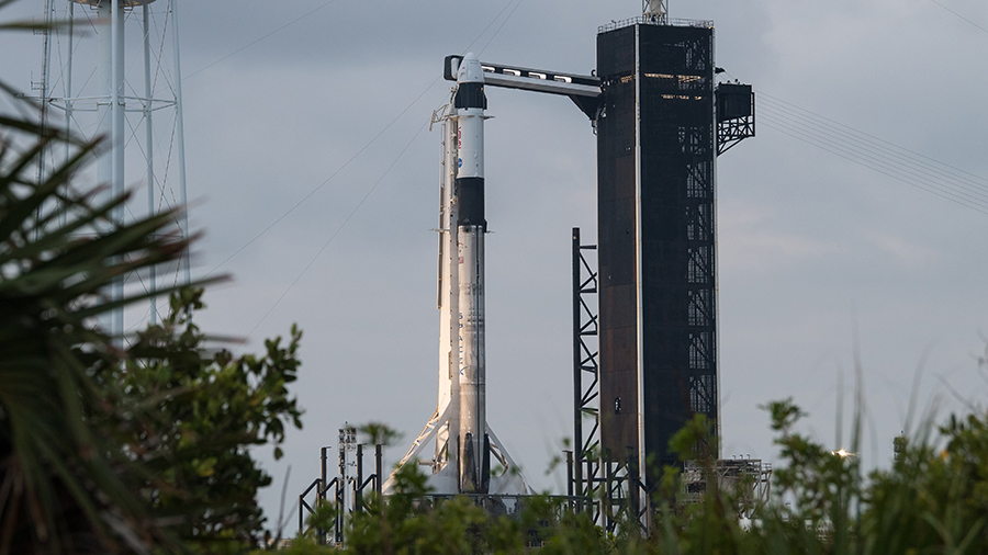 The SpaceX Falcon 9 rocket with the Crew Dragon Endeavour atop stands at the Kennedy Space Center launch pad in Florida. Credit: NASA/Aubrey Gemignani