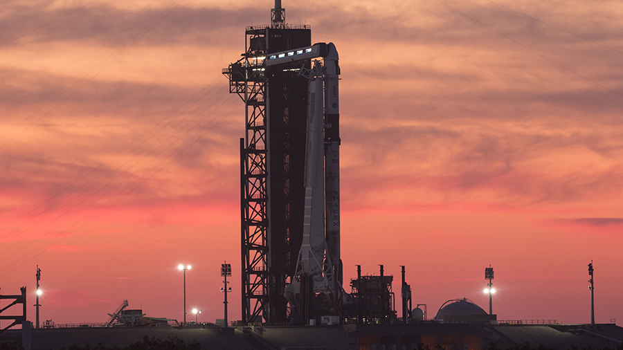 The SpaceX Crew Dragon Endeavour sits atop the Falcon 9 rocket during a sunset at the Kennedy Space Center in Florida. Credit: NASA/Joel Kowsky