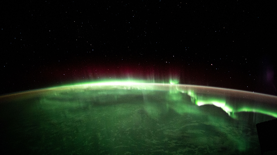 An aurora is pictured streaming above the Indian Ocean in between Australia and Antarctica on April 19, 2021.